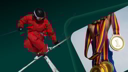 Esquiador saltando con una imagen de fondo de medallero